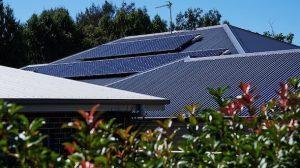 Happy family with solar panels